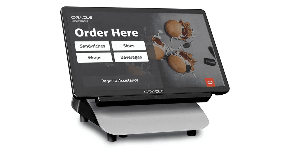 An Oracle Hospitality self-order kiosk showing a digital menu with sandwich and beverage options